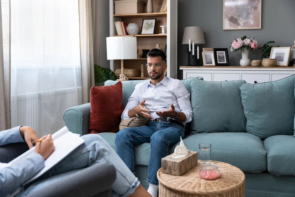 a-man-speaking-to-therapist-on-the-couch