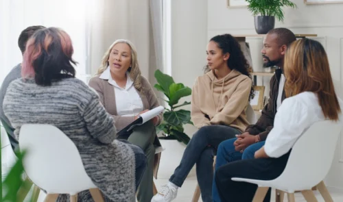 Group therapy exploring aftercare programs for relapse prevention